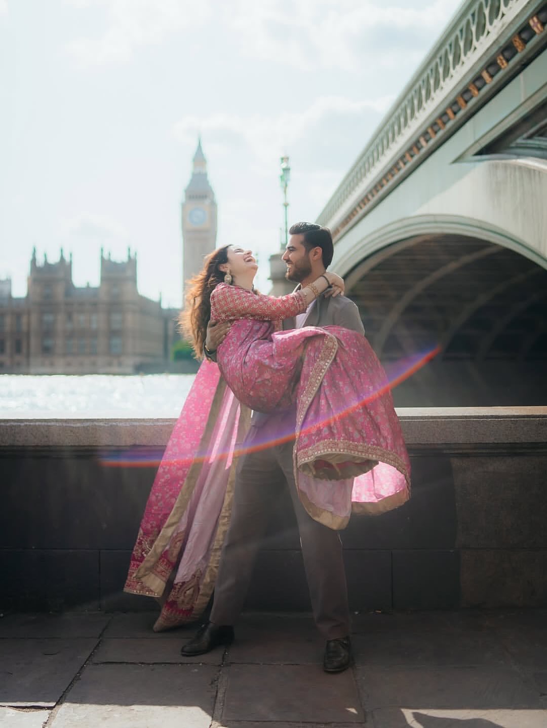 Shailee and Chaitanya laughing together in London with Big Ben in the background